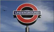  ?? ALASTAIR GRANT — THE ASSOCIATED PRESS ?? A bird flies above an Undergroun­d sign at one of the entrances to King’s Cross tube station in London on Friday.