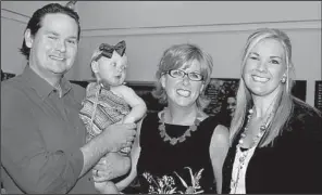  ??  ?? Maureen Mitchell of New York (second from right) with Dan Noble,
his daughter, Stella, 1, and wife, Lynnette