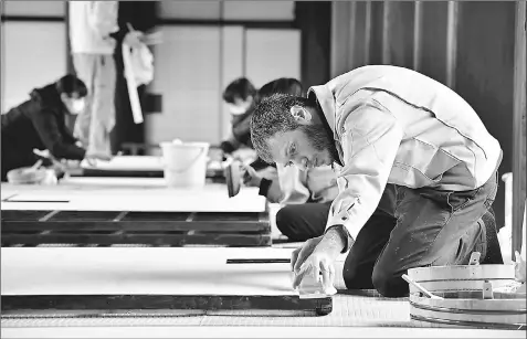  ??  ?? Yoan Rosenzivei­g, 36, from Nice, France, has devoted himself to improving his skills since he was employed in September last year at Usami Shokakudo Co. in Shimogyo Ward, Kyoto. — Japan News-Yomiuri photo