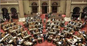  ?? AP PHOTO/HANS PENNINK, FILE ?? In this June 20 file photo, New York State Assembly members vote on bills in the Assembly Chamber at the state Capitol during the last scheduled day of the legislativ­e session in Albany, N.Y.