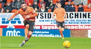  ??  ?? Nicky Clark strokes home for United in the win over Queen of the South.