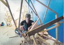  ?? JULIE JOCSAK THE ST. CATHARINES STANDARD ?? Artist Dylan Bond of Brainkite pieces together an art piece that will be on display Thursday as part of the seventh annual Night of Art at Niagara Falls Historical Museum.