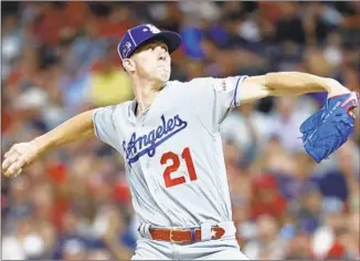  ?? John Minchillo Associated Press ?? WALKER BUEHLER was hiding an injury when he pitched at Vanderbilt. Scout Marty Lamb warned the Dodgers, but also told them Buehler was still worth taking in the first round.