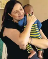  ?? Picture:SUPPLIED ?? HELPING A GOOD CAUSE: Co-ordinator and house mother of Breath of Life Michelle Rielly holds one of the babies looked after by the organisati­on