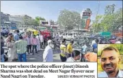  ?? SANJEEV VERMA/HT PHOTOS ?? The spot where the police officer (inset) Dinesh Sharma was shot dead on Meet Nagar flyover near Nand Nagri on Tuesday.