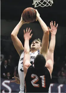  ?? Ben Margot / Associated Press ?? St. Mary’s Jock Landale, who had 10 points and 10 rebounds, shoots over Pacific’s Jacob Lampkin in the second half.