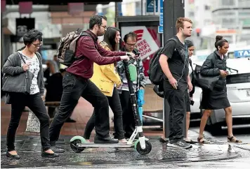  ?? GETTY IMAGES ?? A proposed law change will impose a 10kmh speed on Lime scooters being used on the footpath.