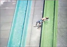  ?? JOSE CARLOS FAJARDO — STAFF ARCHIVES ?? A child is thrown out of the Emerald Plunge water slide at the Wave water park in May 2017. The water slide will reopen this weekend.