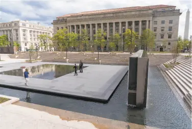  ?? Jacquelyn Martin / Associated Press ?? People visit the newly opened World War I Memorial in Washington. The tribute was constructe­d in Pershing Park — rather than along the National Mall, where many supporters had envisioned.