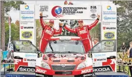  ??  ?? Team MRF driver Esapekka Lappi and co-driver Janne Ferm celebrate after winning the FIA-Asia Pacific Rally Championsh­ip in Queensland on Sunday.