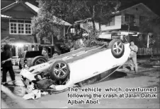  ??  ?? The vehicle which overturned following the crash at Jalan Datuk Ajibah Abol.