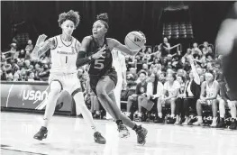  ?? RAUL MARISTANY UM Athletics ?? UM guard Jaida Patrick drives past Florida State’s Brianna Turnage in the first half at the Watsco Center in Coral Gables. Patrick had seven points and three rebounds in the game.