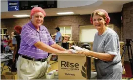  ??  ?? More than 1,000 volunteers gathered Aug. 11 at Dunwoody United Methodist Church for FoodStock 2018. They packed 313,416 dehydrated meals for Rise Against Hunger, a nonprofit that is aiming to end world hunger by 2030.