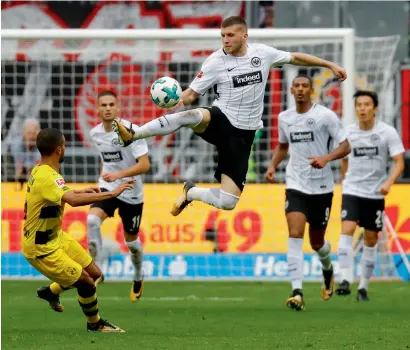  ?? Reuters ?? Frankfurt’s Ante Rebic vies for the ball with Borussia Dortmund’s Jeremy Toljan during a Bundesliga match. —