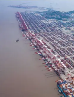  ??  ?? SHIPPING CONTAINERS seen at the Yangshan Deepwater Port in this aerial photograph taken in Shanghai, China, on July 12.