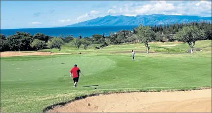  ?? ORANGE COUNTY REGISTER PHOTO ?? The island of Molokai makes for a breathtaki­ng backdrop on many of Kapalua’s challengin­g holes.