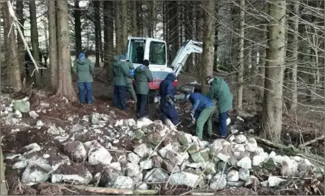  ??  ?? Gardai in woodlands near Omeath where they uncovered a substantia­l arms cache.