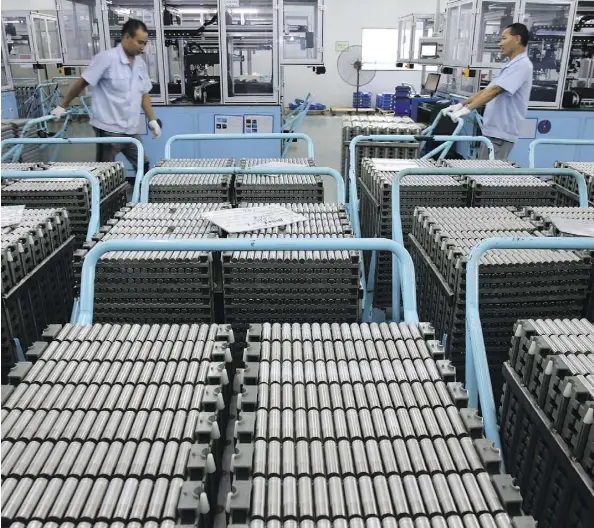  ?? CHINATOPIX VIA AP ?? Workers transfer lithium-ion batteries in a factory in Taizhou in east China’s Jiangsu province last month. China’s shipments to the U.S. rose 13 per cent in July from a year earlier, to US$41.5 billion, as the U.S.’s extra 25-per-cent tariffs on Chinese imports are set to start Aug. 23.