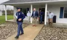  ?? ?? Michigan state police exit the Adams Township Hall after executing a search warrant, on 29 October 2021 in Hillsdale, as part of an investigat­ion into actions by Clerk Stephanie Scott. Photograph: Corey Murray/AP