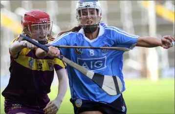  ??  ?? Wexford’s Amy Cardiff challenges Eimear McCarthy of Dublin.