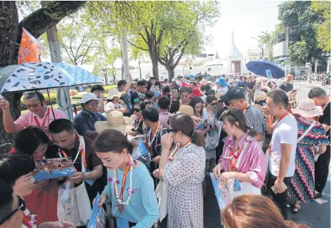  ?? TAWEECHAI TAWATPAKOR­N ?? A group of Chinese tourists visited the Grand Palace in October. Last year saw about 10 million arrivals from China.