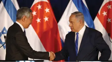  ?? (Reuters) ?? PRIME MINISTER Benjamin Netanyahu and Singapore’s Prime Minister Lee Hsien Loong shake hands as they deliver joint statements in Jerusalem on April 19.