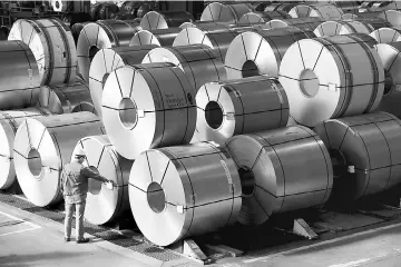  ?? — Reuters photo ?? Steel rolls are seen at the plant of German steel company Salzgitter AG in Salzgitter, Germany. The United States might have no choice but to resort to ‘broad-scale’ measures to fight steel dumping should its partners fail to help find a common...