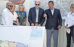  ?? EVAN VUCCI/AP ?? President Joe Biden and first lady Jill Biden are briefed by Puerto Rico Gov. Pedro Pierluisi on Hurricane Fiona, Monday, in Ponce, Puerto Rico.