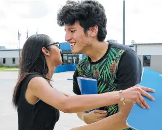 ?? Photos by Kin Man Hui / Staff photograph­er ?? Francisco Galicia, 18, gets a hug from attorney Claudia Galan after his release from the South Texas Detention Facility in Pearsall. He’d been held since being stopped at a checkpoint June 27.