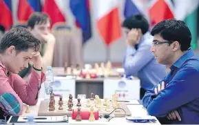  ?? WORLD CUP OF CHESS VIA TWITTER ?? Canadian chess grandmaste­r Anton Kovalyov, left, says he was told he could not wear short pants at the World Cup of chess. A day earlier, he had knocked out Viswanatha­n Anand of India while wearing shorts.