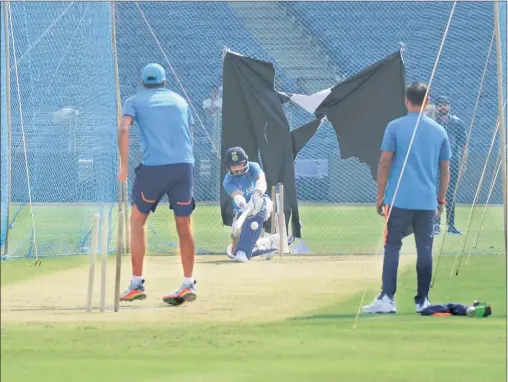  ?? Daniel Stephen ?? India captain Virat Kohli plays a sweep shot at a practice session in Pune on Friday.