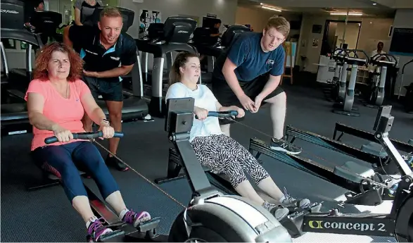  ?? KENDALL HUTT/STUFF ?? Shania Allport and Brody Harper-Moulton (right) beat Andrea (left) and David Allport in the rowing challenge, cheered on by Tyler Wallace.