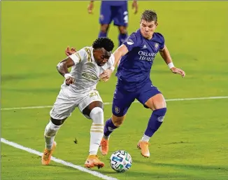  ?? JOHN RAOUX/ASSOCIATED PRESS ?? George Bello (left, playing against Orlando City on Oct. 28) led the Atlanta United’s field players in minutes because there was no consistent healthy backup for him.