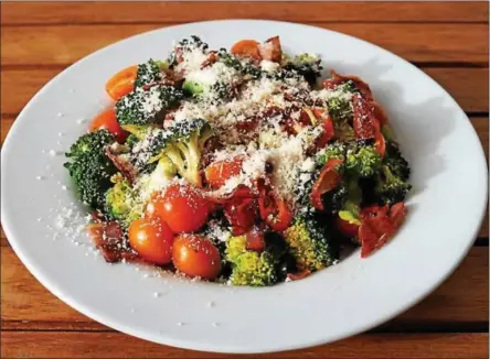  ?? PHOTO COURTESY OF WOLFF’S APPLE HOUSE ?? Try this simple, flavorful combinatio­n of broccoli, cherry tomatoes, bacon and Parmesan.