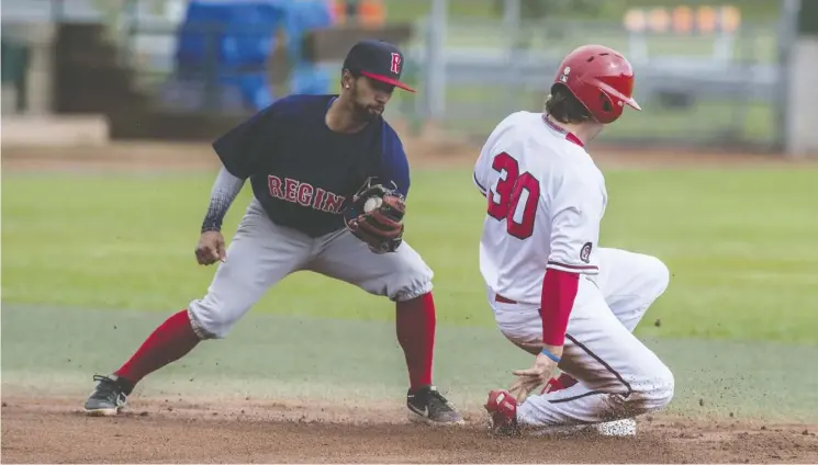  ?? Shaughn Butts ?? Nick Garcia of the Brooks Bombers steals second base as the throw comes too late to Adam De La Cruz of the Regina Red Sox at Saturday’s WCBL All-Star Game.