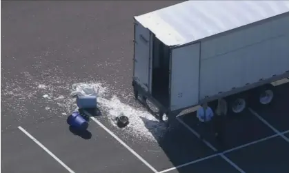  ?? ?? The tractor-trailer parked in north-east Philadelph­ia after robbers allegedly broke in and made off with some of its cargo of coins from the US Mint. Photograph: 6abc.com