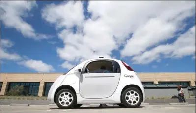  ??  ?? PROTOTYPE: Google’s new self-driving prototype car is presented during a demonstrat­ion May 13 at the Google campus in Mountain View, Calif. The tech titan wants the freedom to give the public access to self-driving prototypes it has been testing on...