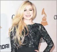  ?? \THE CANADIAN PRESS ?? Avirl Lavigne, seen arriving at the 2016 Clive Davis Pre-Grammy Gala in Beverly Hills, Calif., is the most likely celebrity to land users on websites that carry viruses or malware, according to Cybersecur­ity firm McAfee.