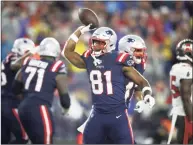  ?? Adam Glanzman / Getty Images ?? The Patriots’ Jonnu Smith reacts after a touchdown against the Buccaneers during the fourth quarter in the game at Gillette Stadium last Sunday.