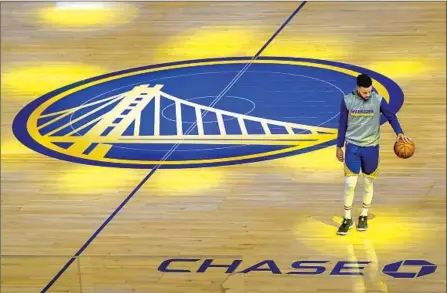  ?? Jeff Chiu Associated Press ?? GOLDEN STATE GUARD Stephen Curry warms up before another game with no fans against Cleveland on Feb. 14 in San Francisco.