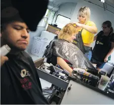  ??  ?? Joanne Mackenzie gets a haircut from Onneka Verriere on Sunday.