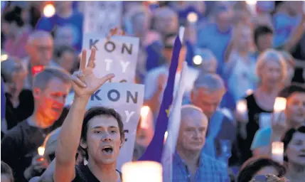  ?? REUTERS ?? People gather in front of the Supreme Court during a protest against planned legislatio­n in Warsaw on Saturday.