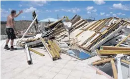  ?? TAIMY ALVAREZ/STAFF PHOTOGRAPH­ER ?? Bob Markotic surveys the destructio­n of his client’s home in Jolly Roger Estates on Little Torch Key, a home where he did a lot of work.