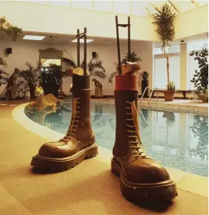  ??  ?? These boots were made by local chemical firm Scott Bader for Elton John to wear in the film Tommy. They are shown here at his Berkshire home, but are now in Northampto­n Museum