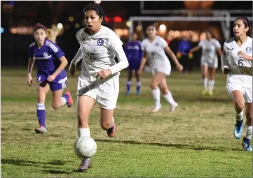  ?? RECORDER PHOTOS BY CHIEKO HARA ?? Monache High School’s Jessica Madrigal dribbles down the field Tuesday during the second half against Lemoore High School at Monache High School.