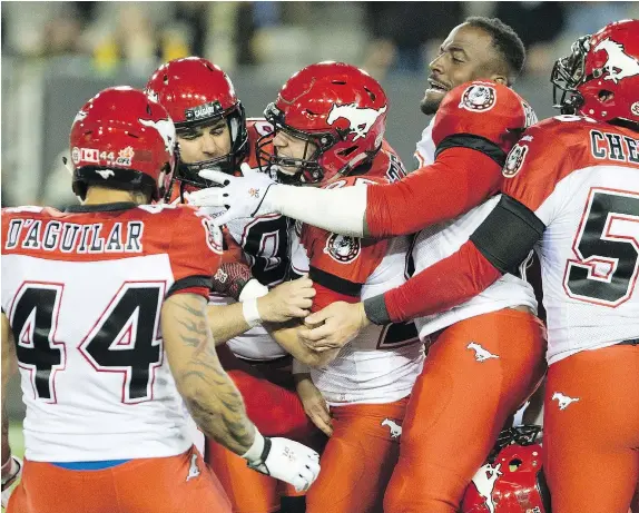  ?? — THE CANADIAN PRESS FILES ?? The Calgary Stampeders have a history of close games against the Hamilton Tiger-Cats and often it comes down to kicker Rene Paredes, who was swarmed by teammates after making an end-of-game winning field goal to defeat Hamilton in 2015.