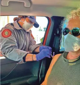  ?? AP ?? Tami Katz–Freiman, of Miami, Florida, gets her second dose of COVID-19 vaccine and plans to wear a mask while watching a film festival virtually.