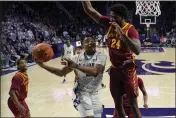  ?? CHARLIE RIEDEL — THE ASSOCIATED PRESS ?? Kansas State guard Tylor Perry looks to shoot under pressure from Iowa State forward Hason Ward (24) during the second half Saturday in Manhattan, Kan. Kansas State won 65-58.