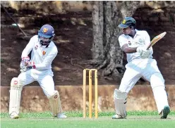  ??  ?? D.S. Senanayake batsman Muditha Lakshan squarecuts one to the fence against Ananda - Pic by Ranjith Perera