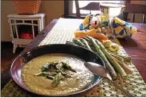 ?? PHOTO BY EMILY RYAN ?? Looking forward to the first local asparagus? Enjoy it in chef Jenny Young’s asparagus leek soup.